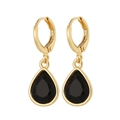 Close-up of teardrop earrings with faceted black stones and golden huggie closures - Black