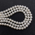 Single strand of round white faux pearl beads with hole for DIY jewelry making - White
