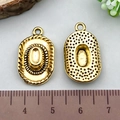 Golden cowboy hat alloy charms for DIY jewelry with ruler showing 1.5 cm size detail - Antique Gold Cowboy Hat (19240)