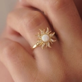 Golden sunburst opal ring with sparkling zircon accents on finger for women - White Opal Ring (Gold)