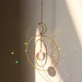 Golden moon and star suncatcher with faceted crystal ball creating rainbow reflections - US 11