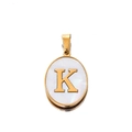 Macro shot of oval stainless steel pendant with gold letter K and mother of pearl inlay - Gold Letter K