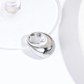 Close-up of polished silver geometric oval pendant with a round hole for DIY jewelry - Silver Medium Pebble (25*18MM)
