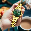 Women's gold quartz watch with an emerald green sunburst dial and a slender steel bracelet - Roman All Gold Green Dial Women's