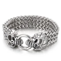 Detail of vintage men's stainless steel Franco link bracelet with carved wolf heads - 21cm / Steel Skull