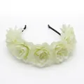 Detail of white fabric rose flower crown with layered silk petals for bridal photography - Cream