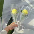 Detail of handmade yellow chenille pipe cleaner tulip bouquet in transparent gift packaging - Light Yellow Tulip with Pearl Gauze