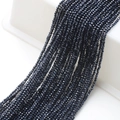 Macro shot of 2mm faceted black glass beads for DIY jewelry and accessories - Hematite Black