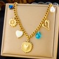 Detailed view of gold plated necklace featuring sunflower, pearl and heart charms in a gift box - Sunflower Heart Pearl Drop Style (N3258)