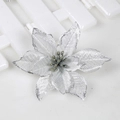 Macro view of a 15cm silver glitter Christmas flower on a white wooden background - Silver with Silver Edge