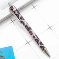 Retractable metal ballpoint pen featuring leopard print with glitter and silver clip - Silver Leopard Print