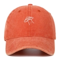 Close-up of high-quality orange washed cotton fabric and white UFO embroidery on cap - Orange