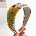 Knotted knit floral headband featuring colorful crochet flowers on a yellow woven base - Yellow Flowers Flat Knitted Headband