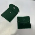 Detail view of dark green velvet jewelry pouches with metallic snap button closure - 8*8cm / Dark Green