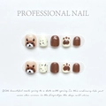 Uñas postizas infantiles con osos marrones y huellas de patas sobre fondo blanco - Extra Pequeño (XS)