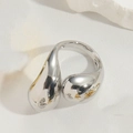 Macro shot of polished silver fluid ring with a glossy water drop design and mirror finish - Water Drop / Silver