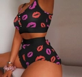 Detail of black camisole pajama set featuring red lip prints and ruffled shorts hem - S / Black Lip Print (A3)