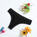 Black low-waist thong with cotton rib texture and delicate lace trim on white background - M(28) / Black