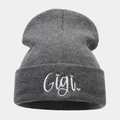 Close-up of gray knit beanie featuring white Gigi script embroidery on the folded cuff - One Size / Dark Gray