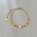 Bracciale in acciaio inossidabile con occhio di tigre e dettaglio perla bianca - Perla Abaco in Topazio/Giada Gialla