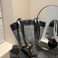 Elegant houndstooth canvas bucket bag with black leather handles in a mirror reflection - Black Style 1 (Black and White Houndstooth)