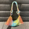 Detailed close-up of rainbow gradient rhinestone handbag with elegant knotted handle - Colorful