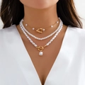 Close-up of layered baroque pearl necklace set with gold chain on fashion model - Double Layer Thin Chain Pearl Toggle (08 Gold Set) / Gold (3960)