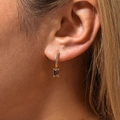 Elegant 18K gold plated drop earrings with purple rectangular zircon on model - Gold Purple Zirconia