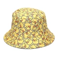 Close-up detail of yellow bucket hat featuring cute cartoon duck patterns and stitching - Cute Duckling Print (I)