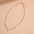 Colorful beaded necklace with faux pearls, turquoise stone, and a white puppy pendant - Necklace-Gold (Unicorn Pendant)