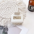 Close-up of a cream matte rectangular claw clip on a stylish woven mat setting - Small Matte Square Claw-Cream White