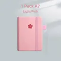 Light pink A7 mini notebook featuring an embossed cherry blossom and elastic band - A7 / 1 Pack - Sakura Logo / Light Pink