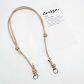 Detail of adjustable beige leather shoulder strap with golden metal rings and knot design - Gold Ring Buckle / Khaki