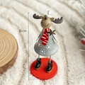 Nordic 16cm metal reindeer sculpture on white carpet with festive holiday decorations - Standing Reindeer with Black Boots