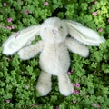 Cream long-eared bunny plush toy lying on green clover background with pink flowers - 40CM / Brown