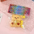 Cute yellow squishy bear with honey pot in original Pinch Family colorful packaging - Light Yellow Bear Style