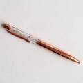Macro view of rose gold crystal pen filled with black and clear quartz stones - Blue Moonstone