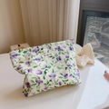 Detailed view of floral cotton makeup bag with blue and purple prints and top zipper - Purple Flower