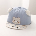 Detail of baby bear embroidery and 3D ears on a light blue cotton sun hat with dots - Blue