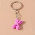 Pink resin floral letter K keychain with detailed rose petal texture and silver ring - Letter X