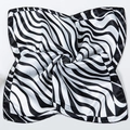 Macro shot of black and white wavy zebra pattern satin scarf with smooth silk texture - Black and White Waves