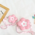 Detail view of pink camellia silicone crossbody bags with adjustable floral straps - Pink