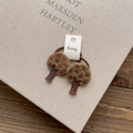 Detail of forest style elastic hair bands featuring green embroidered tree and red berries - Small Tree Hair Tie