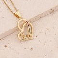 Macro shot of 18K gold heart necklace for Mom with rainbow cubic zirconia on stone base - Double Heart Rainbow Zircon Mom Style (7#)