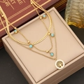 Close-up of three-layer gold necklace with turquoise beads and tree of life pendant - Three-Layer Tree of Life Necklace