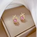 Detailed macro view of gold bow earrings with pink crystal and micro-pave zircons - Pink Gemstone Bowknot Stud Earrings (D132)