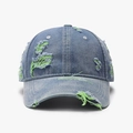 Distressed blue denim baseball cap with green frayed holes and soft top crown - Medium Blue Denim with Green Stitching
