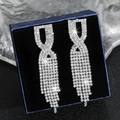 Elegant silver tassel earrings with sparkling crystals in a blue velvet jewelry box - Silver Twisted Rhinestone Tassel Earrings DTE1616979S