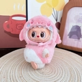 Pink and white plush shark outfit for Labubu vinyl doll on a woven mat home decor - Pink Shark Baby Set / First And Second Generation Keychains Are Compatible With La Cloth Dolls. Dolls Not Included.
