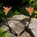 Detail of cat ear headband with orange crystal pillars and beads on a natural rock surface - Orange Yellow Cat Ears